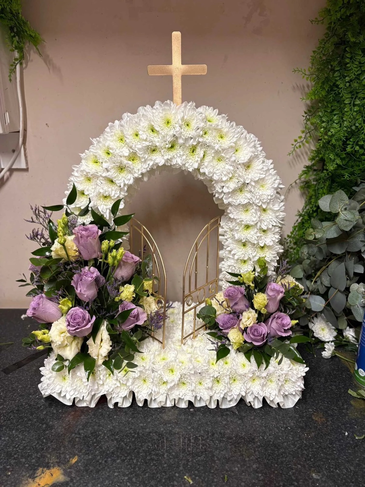 Pastel mixed bouquet of roses, gypsophila and foliage